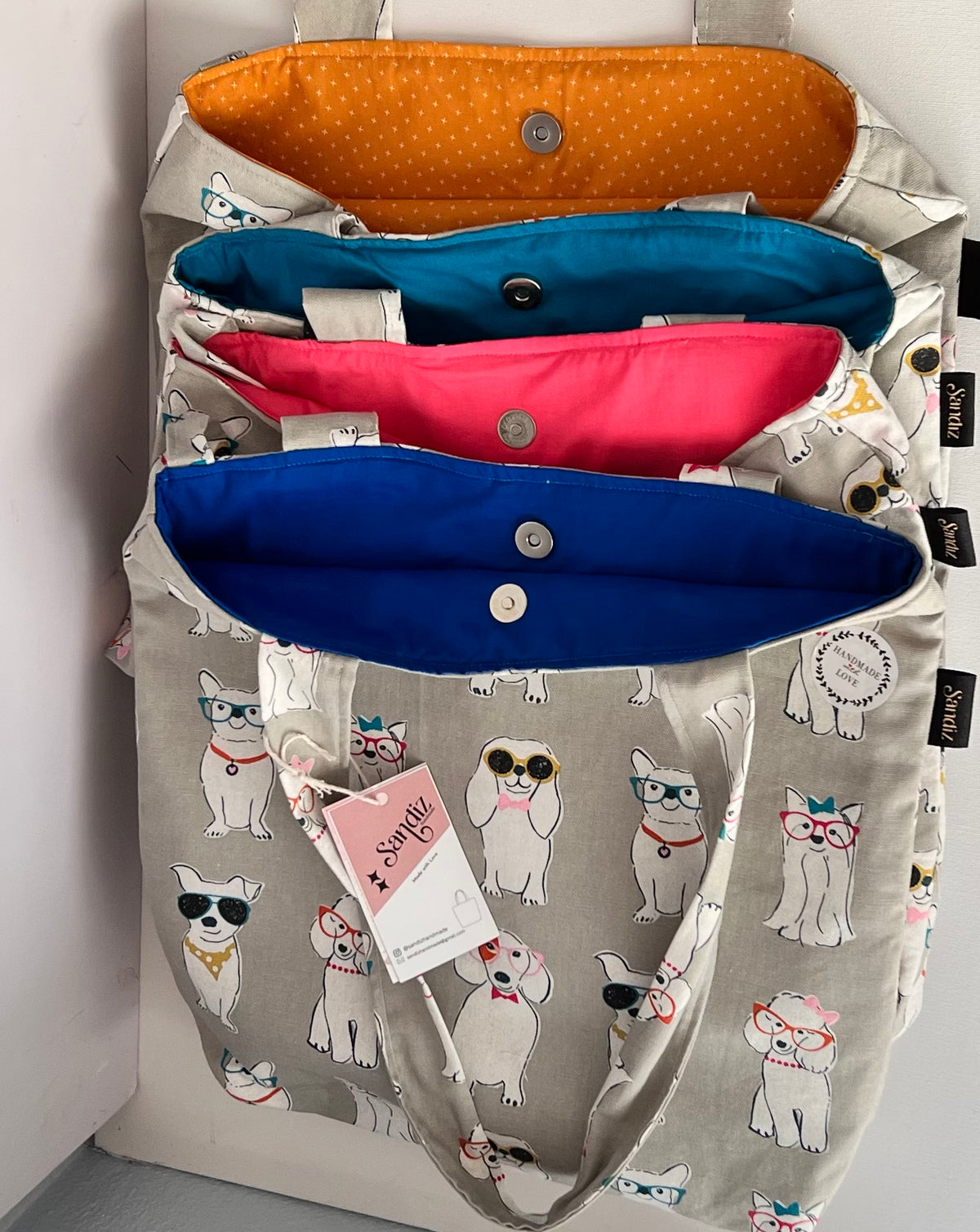 blue, green, red and mustard yellow handmade dog print tote bag with cartoon dogs wearing glasses