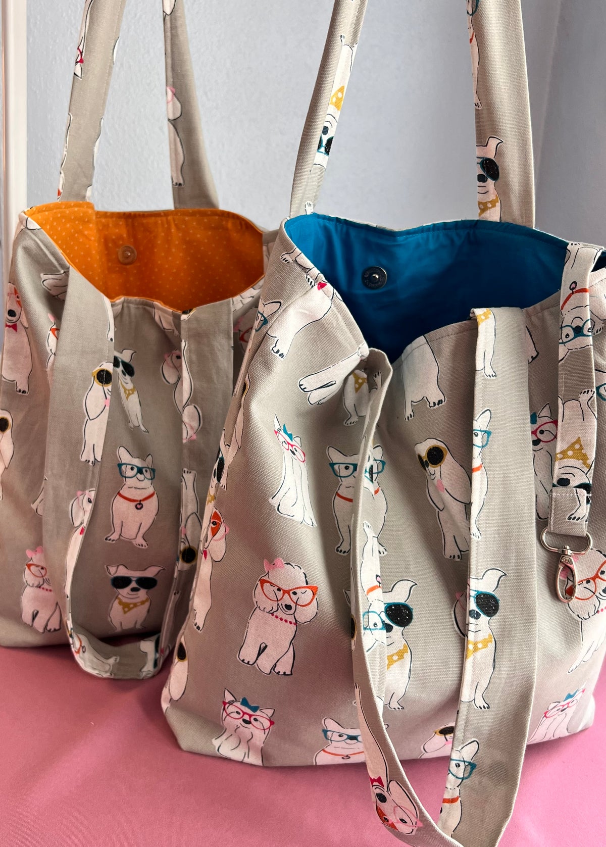 dog print tote bag with blue and mustard yellow interior and inside pocket