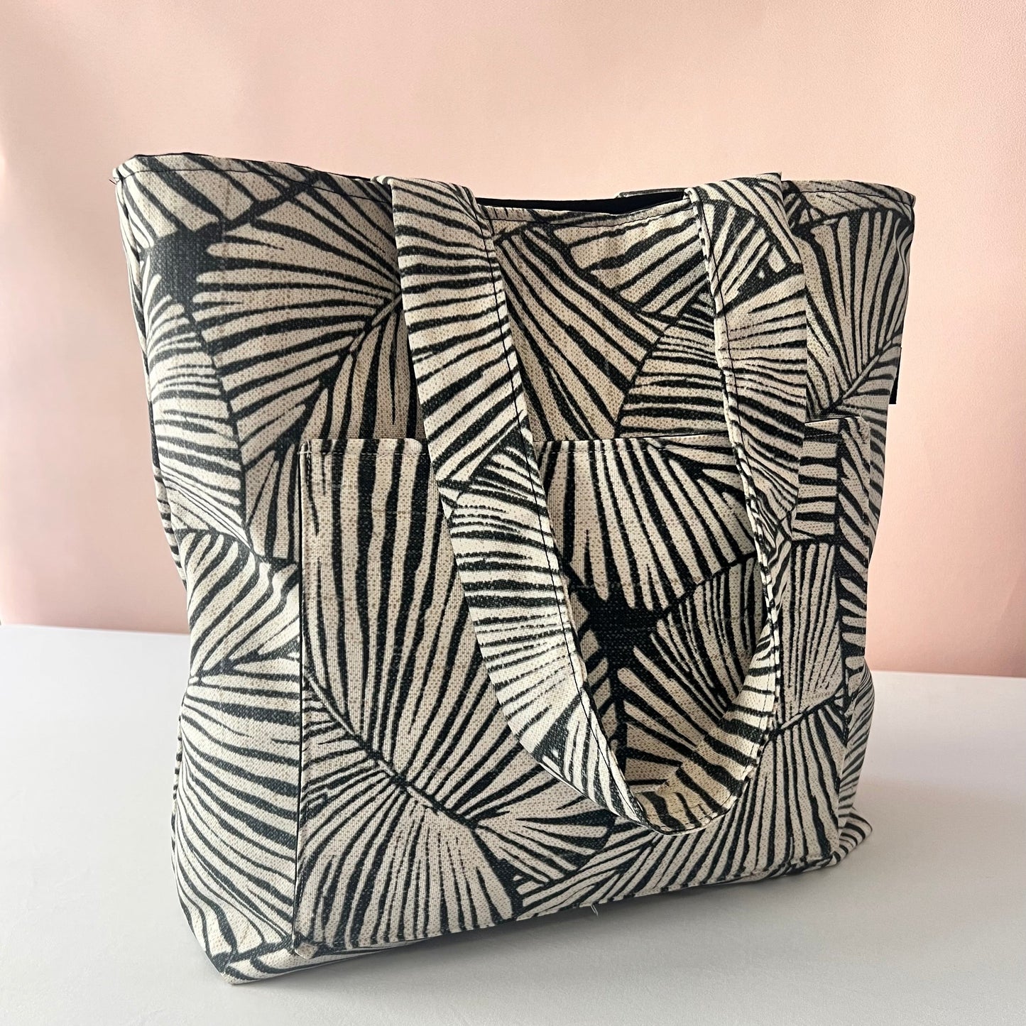 handmade botanical tote bag shown from the side