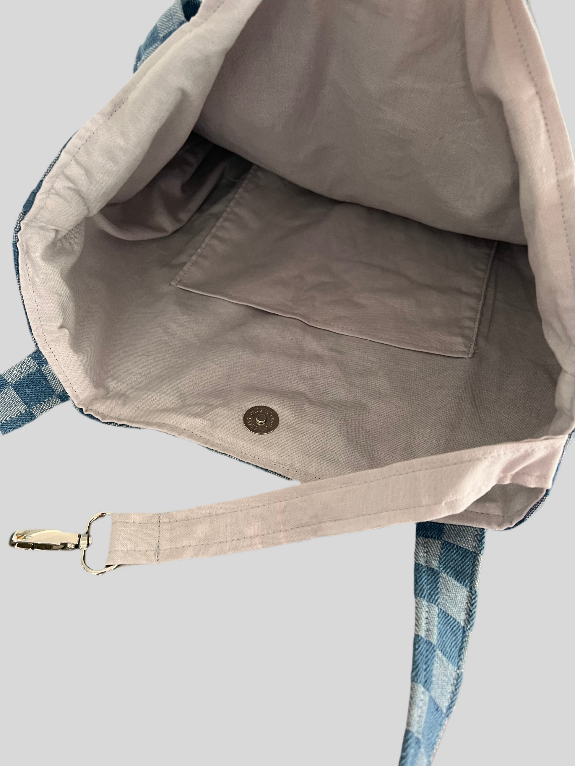 interior pocket in blue checkered denim tote bag