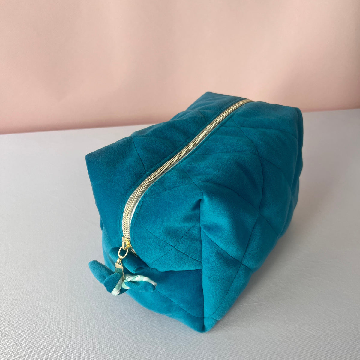 side_view_of_handmade_blue_velvet_cosmetic_bag