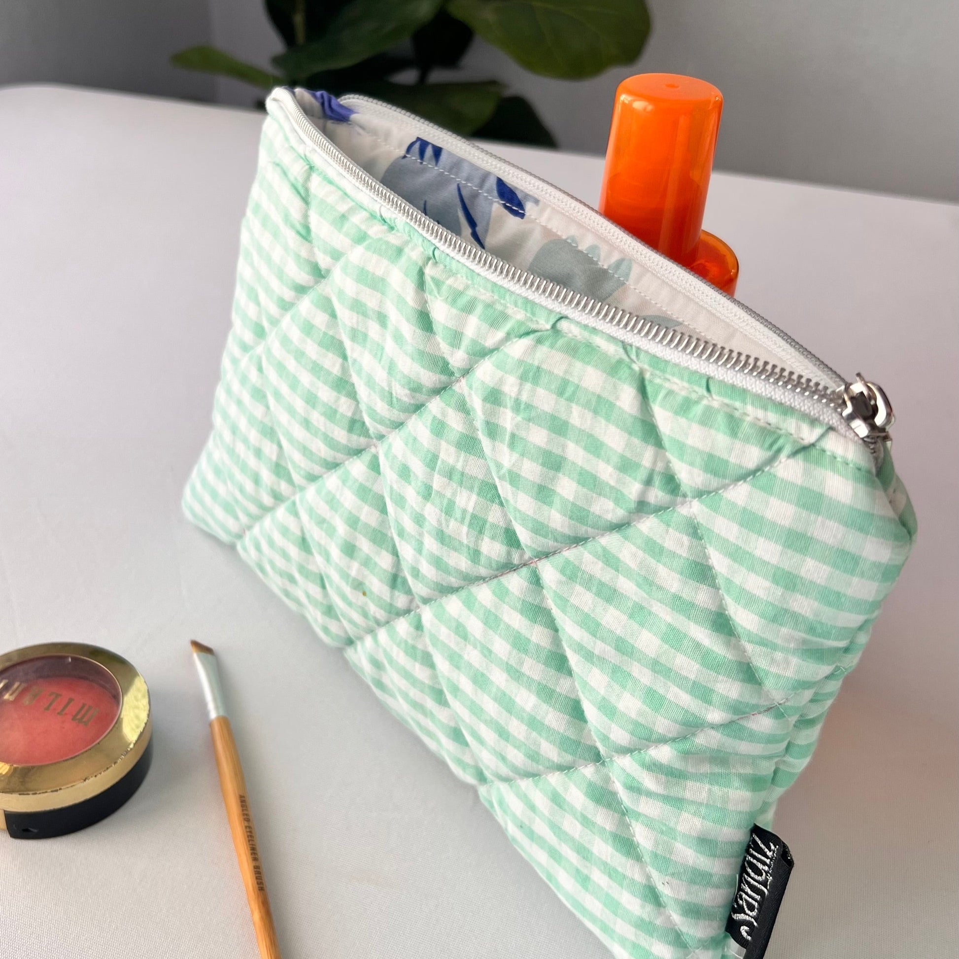 small green gingham cosmetic pouch with silver zipper